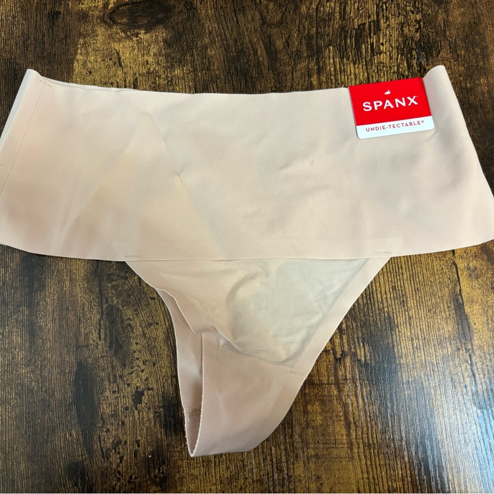 Women’s Size X! “ Undie testable” thong panties by SPANX IN SOFT nude